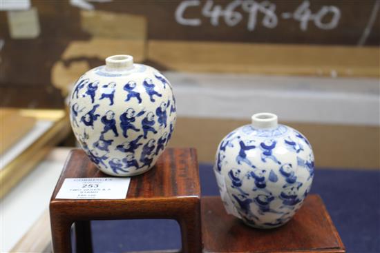 Two Chinese crackleglaze small blue and white vases, painted with figures, late 19th century plus wood scholars stand, tallest 7cm